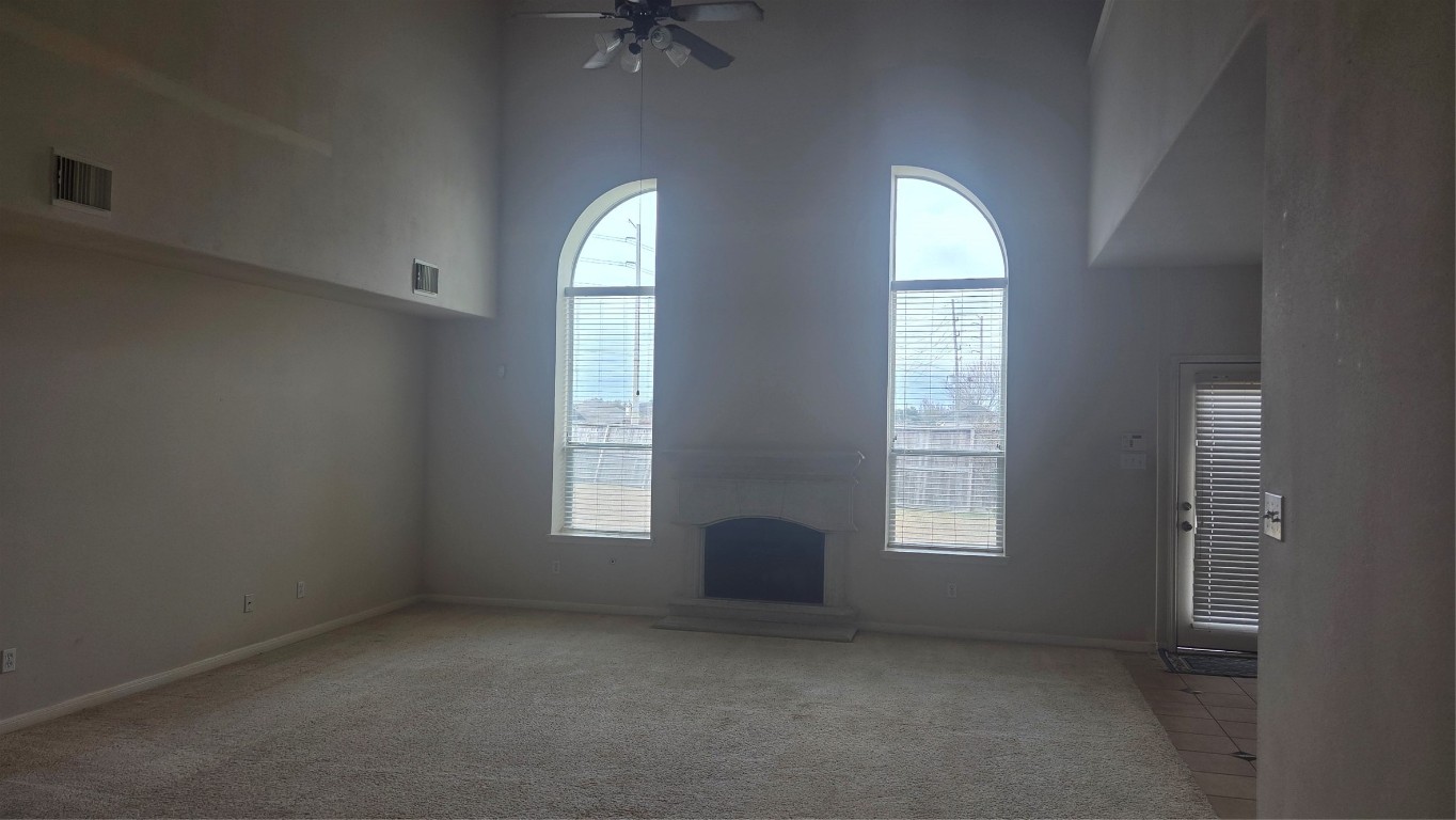 2103 Trinity Manor Lane Richmond, TX 77469 - Photo 1 of 30 an empty room with windows and closet