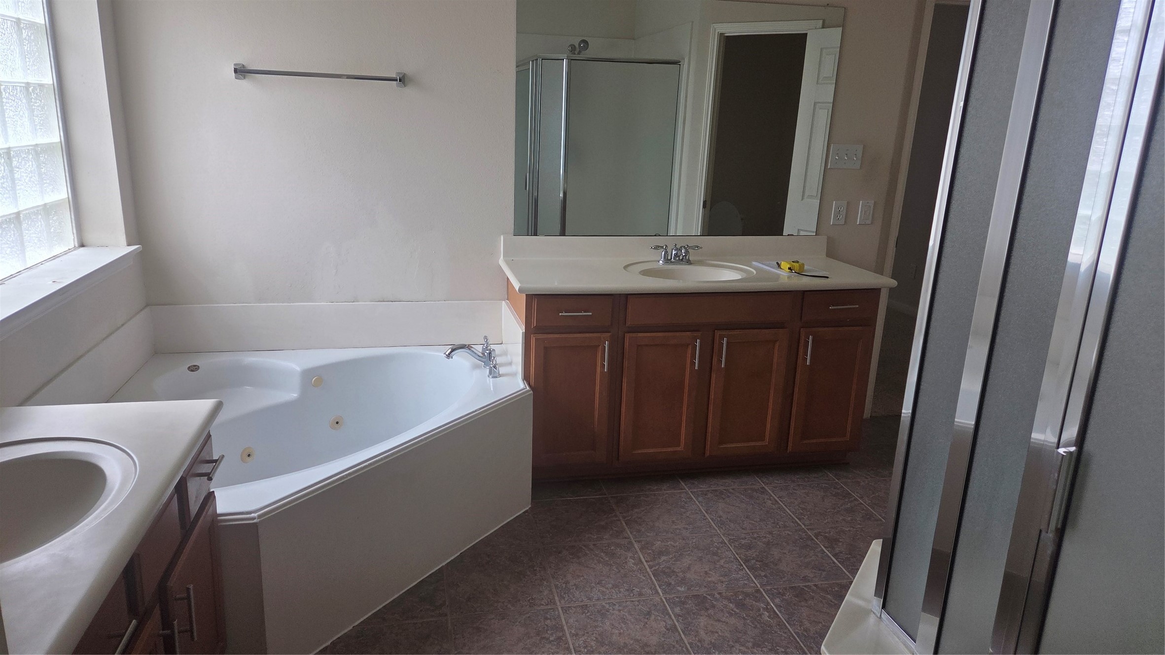 2103 Trinity Manor Lane Richmond, TX 77469 - Photo 17 of 30 a bathroom with a tub sink and mirror