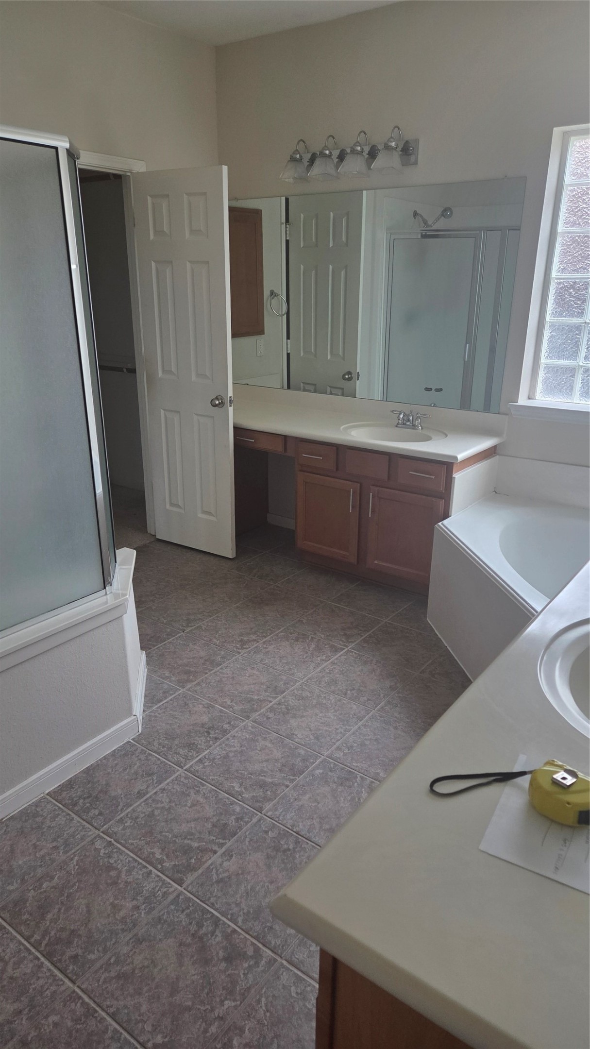 2103 Trinity Manor Lane Richmond, TX 77469 - Photo 18 of 30 a bathroom with a tub sink and mirror