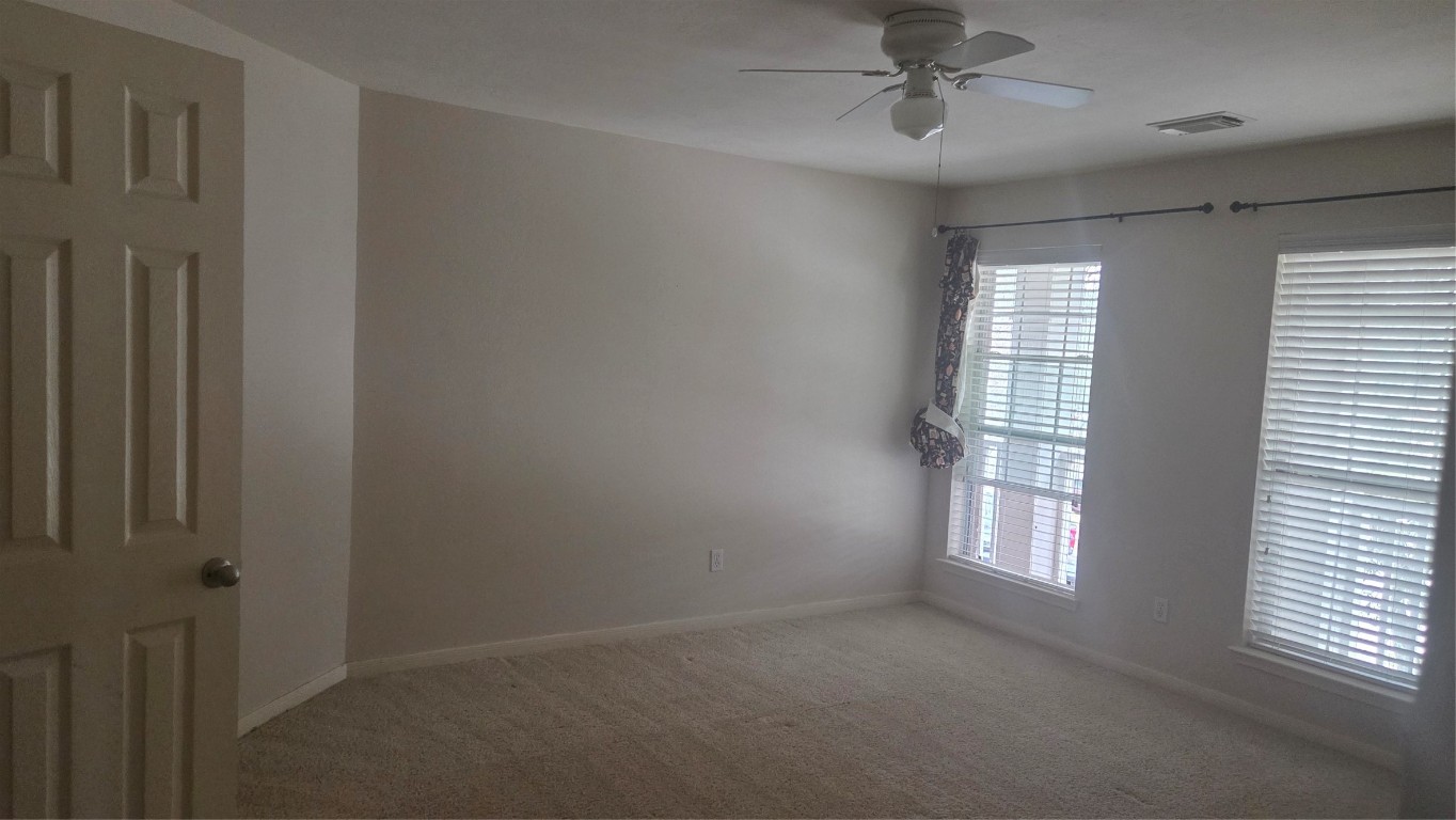 2103 Trinity Manor Lane Richmond, TX 77469 - Photo 2 of 30 an empty room that has a window in it