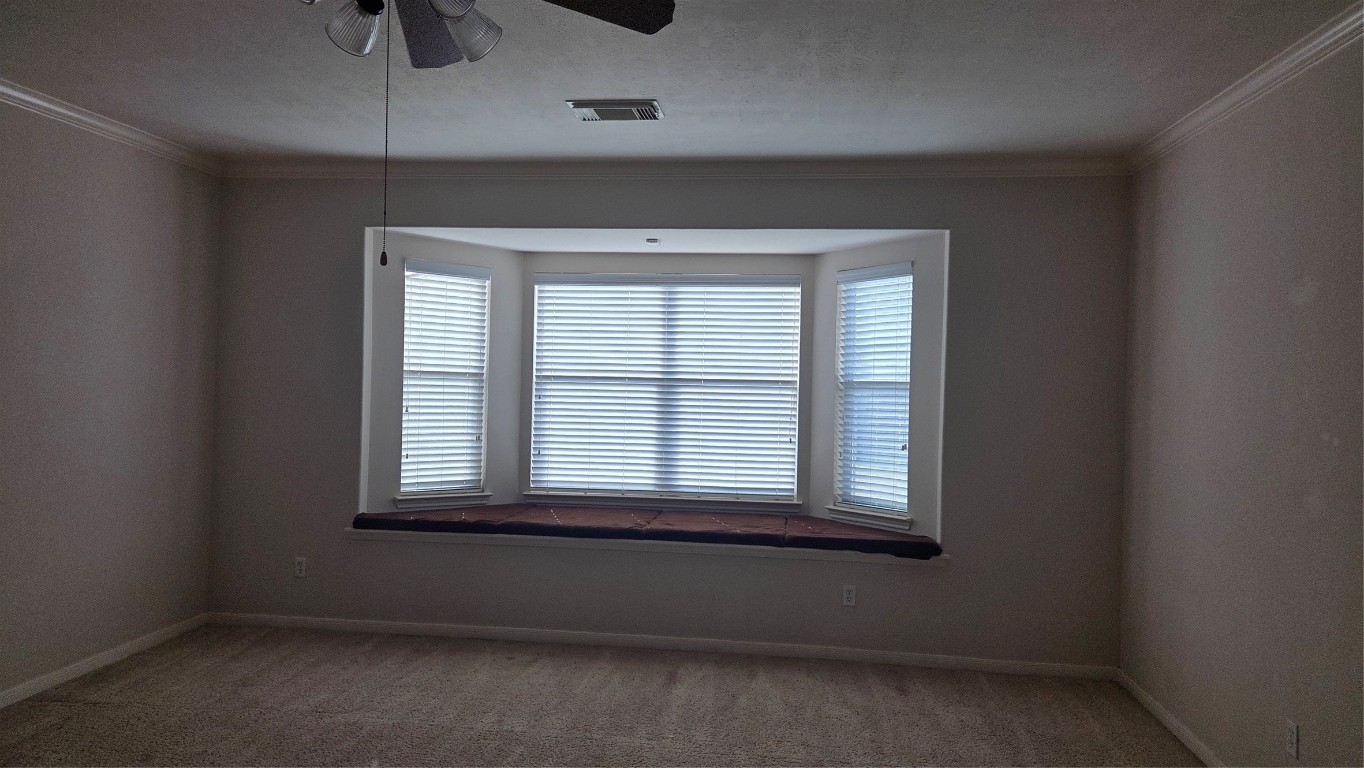 2103 Trinity Manor Lane Richmond, TX 77469 - Photo 25 of 30 an empty room with a window