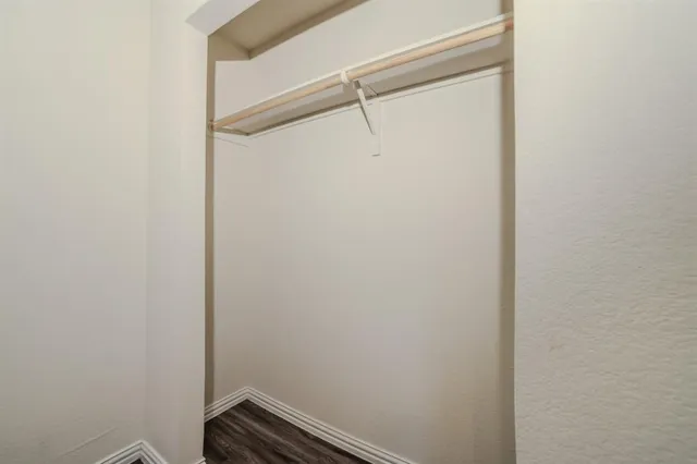 a view of a room with racks on the wall