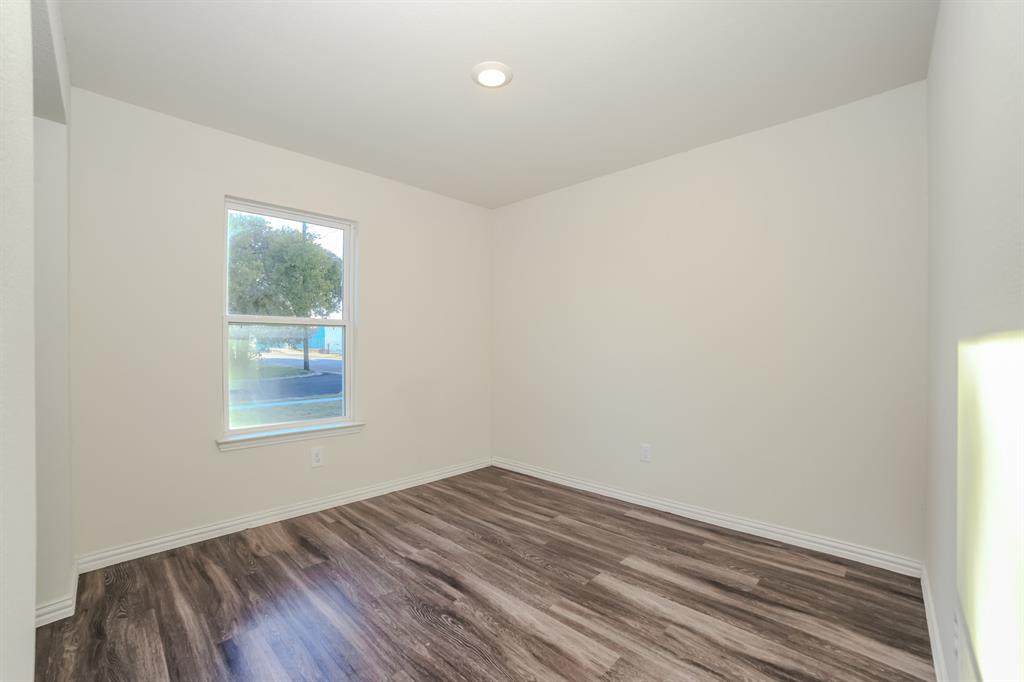 700 Pecan Avenue Waco, TX 76704 - Photo 13 of 19 wooden floor in an empty room