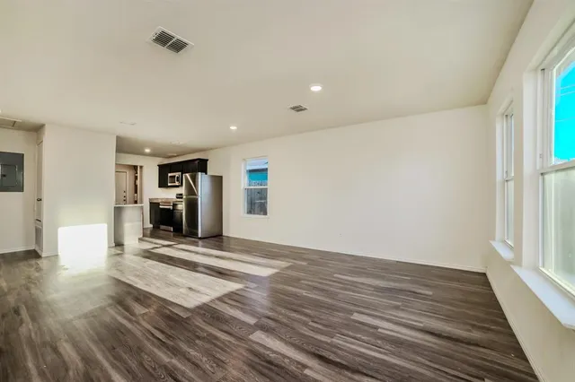 a view of a livingroom with wooden floor