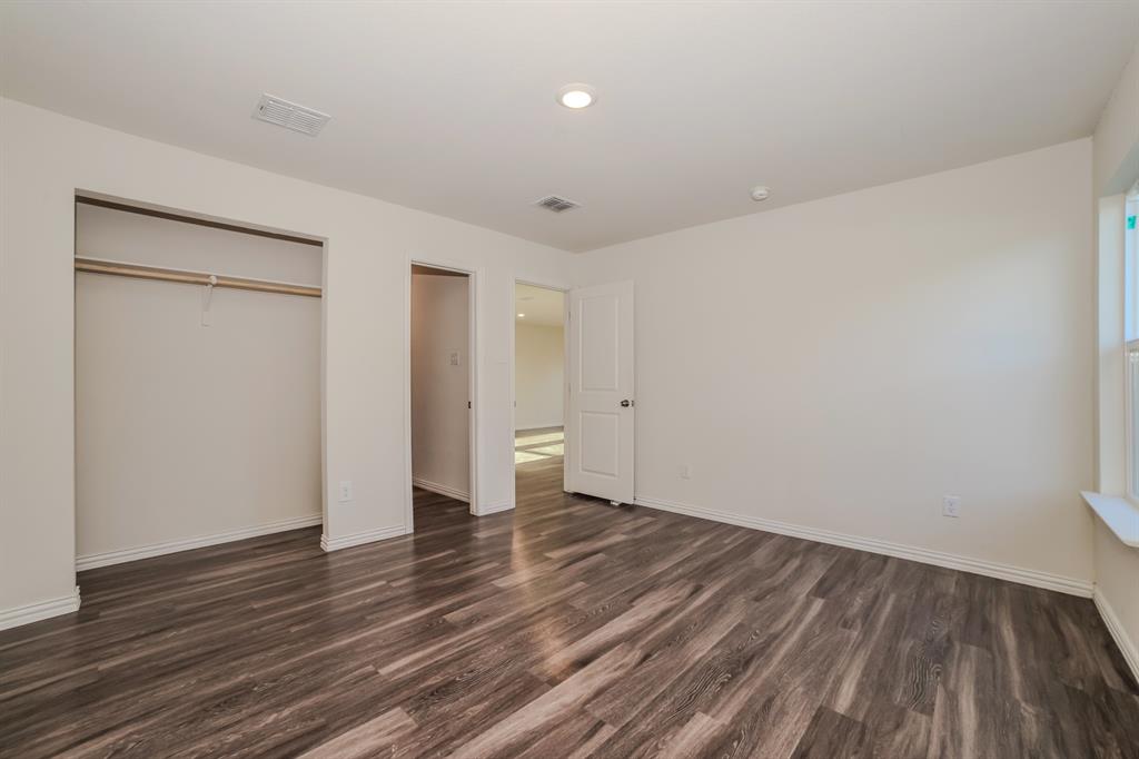 700 Pecan Avenue Waco, TX 76704 - Photo 10 of 19 a view of an empty room with wooden floor