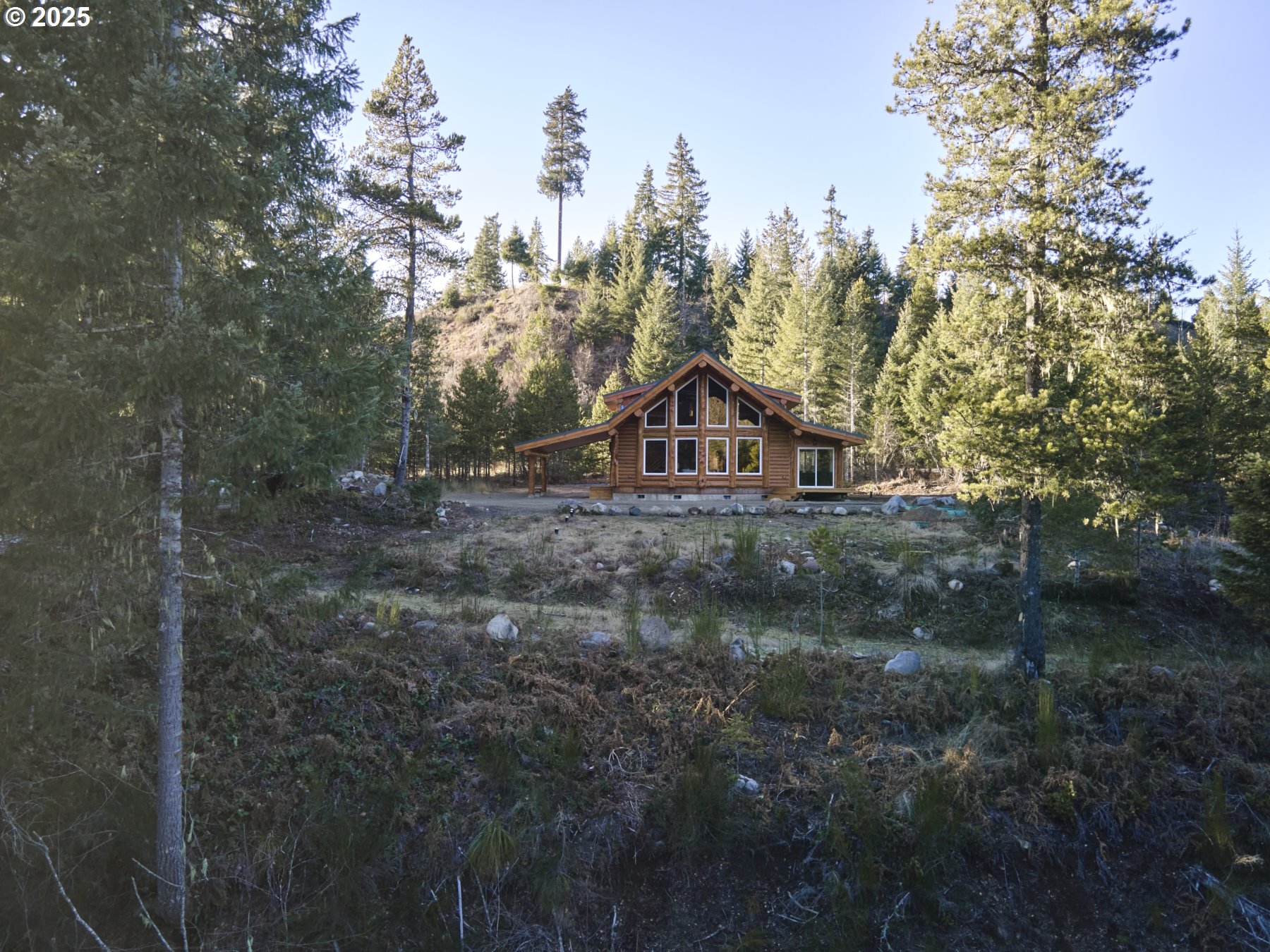 192 Sasquatch Way Cougar, WA 98616 - Photo 2 of 47 a view of a house with a yard