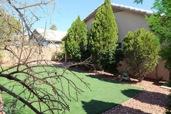 a backyard of a house with lots of green space
