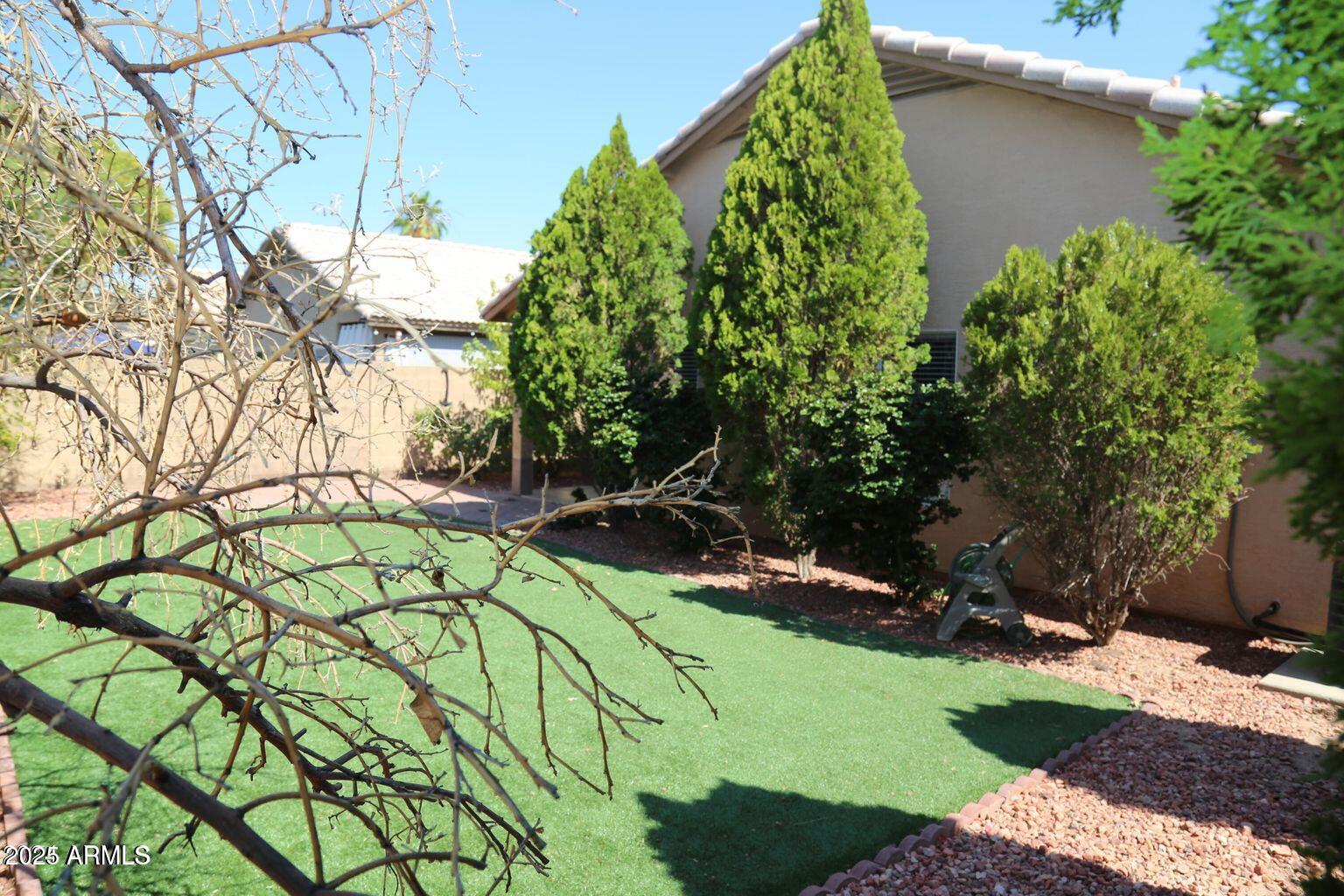 2228 East Aire Libre Avenue Phoenix, AZ 85022 - Photo 21 of 24 a backyard of a house with lots of green space