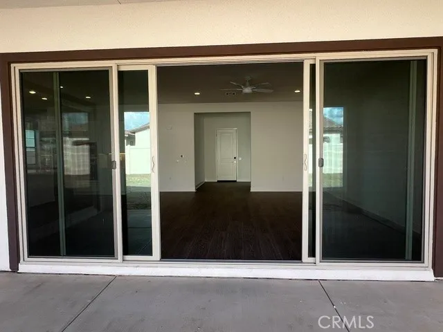 a large kitchen with kitchen island a sink a center island stainless steel appliances and a counter top space
