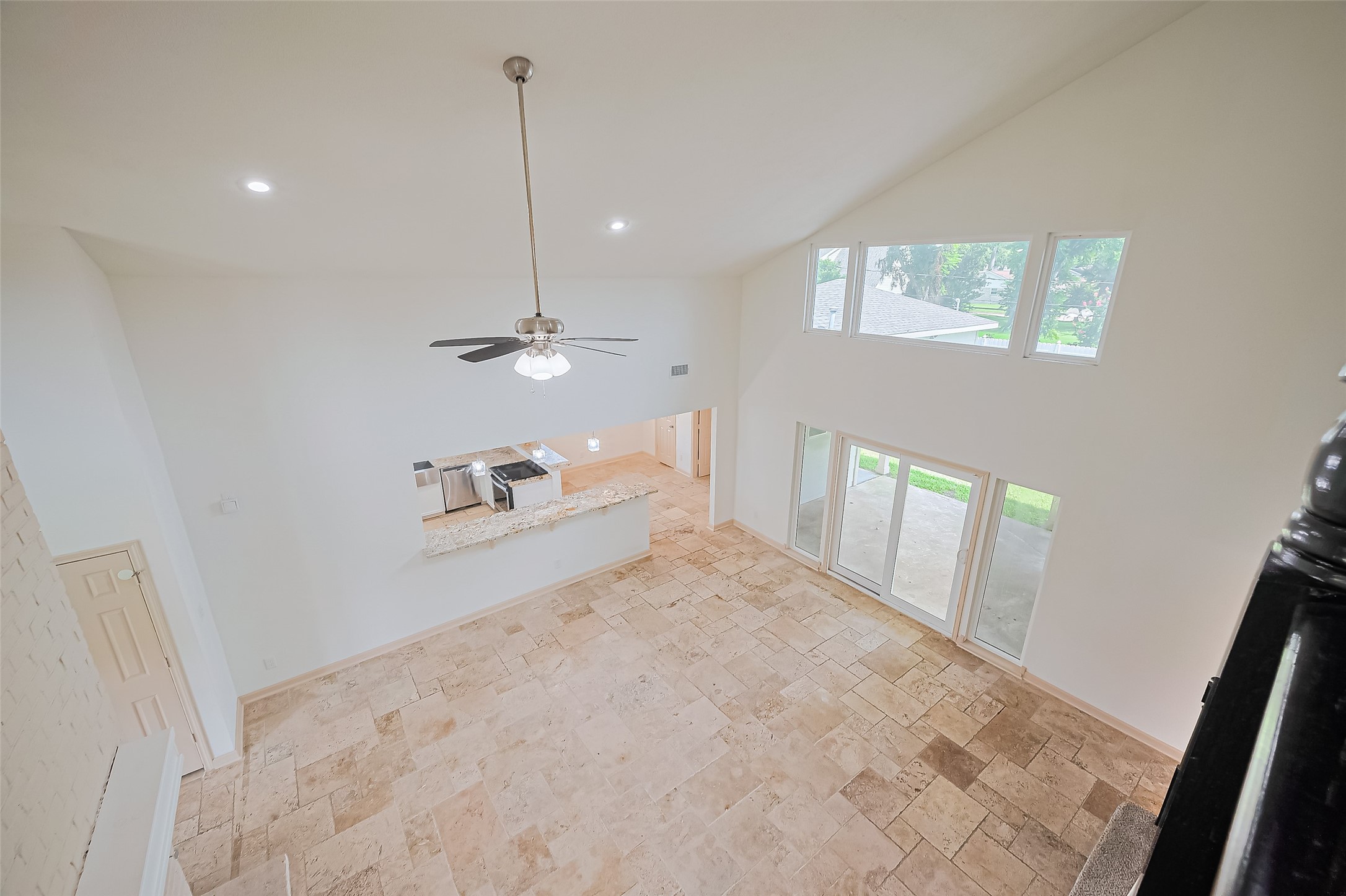 982 West Donovan Street Houston, TX 77091 - Photo 17 of 39 a view of a livingroom with wooden floor and a ceiling fan