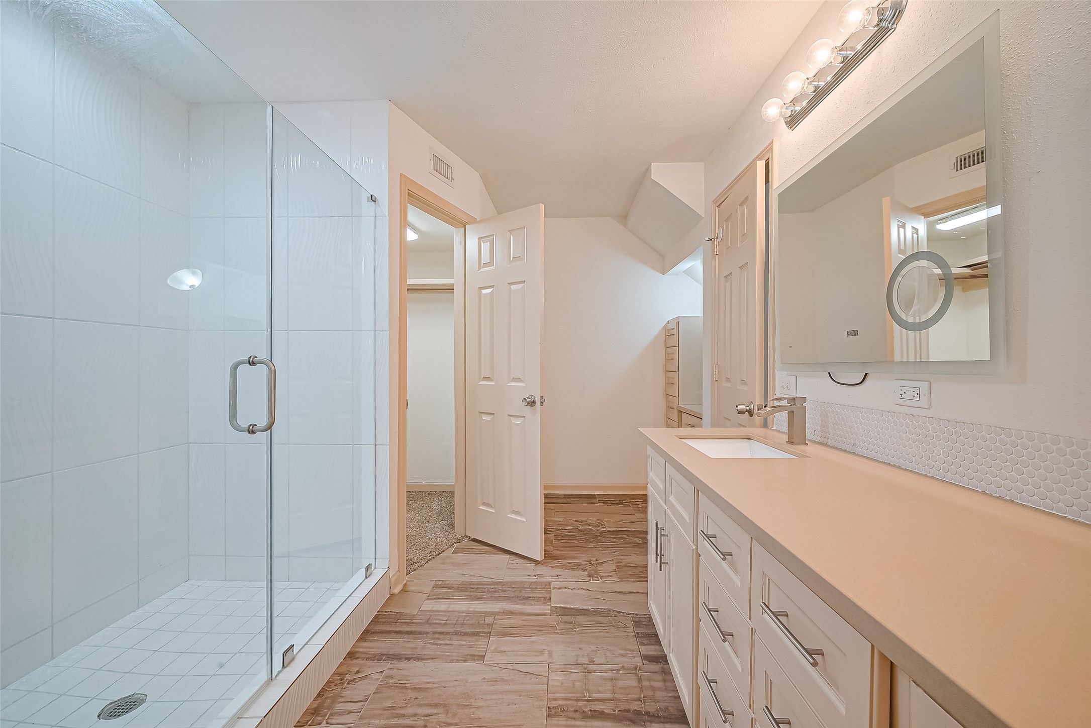 982 West Donovan Street Houston, TX 77091 - Photo 20 of 39 a spacious bathroom with a double vanity sink mirror and shower