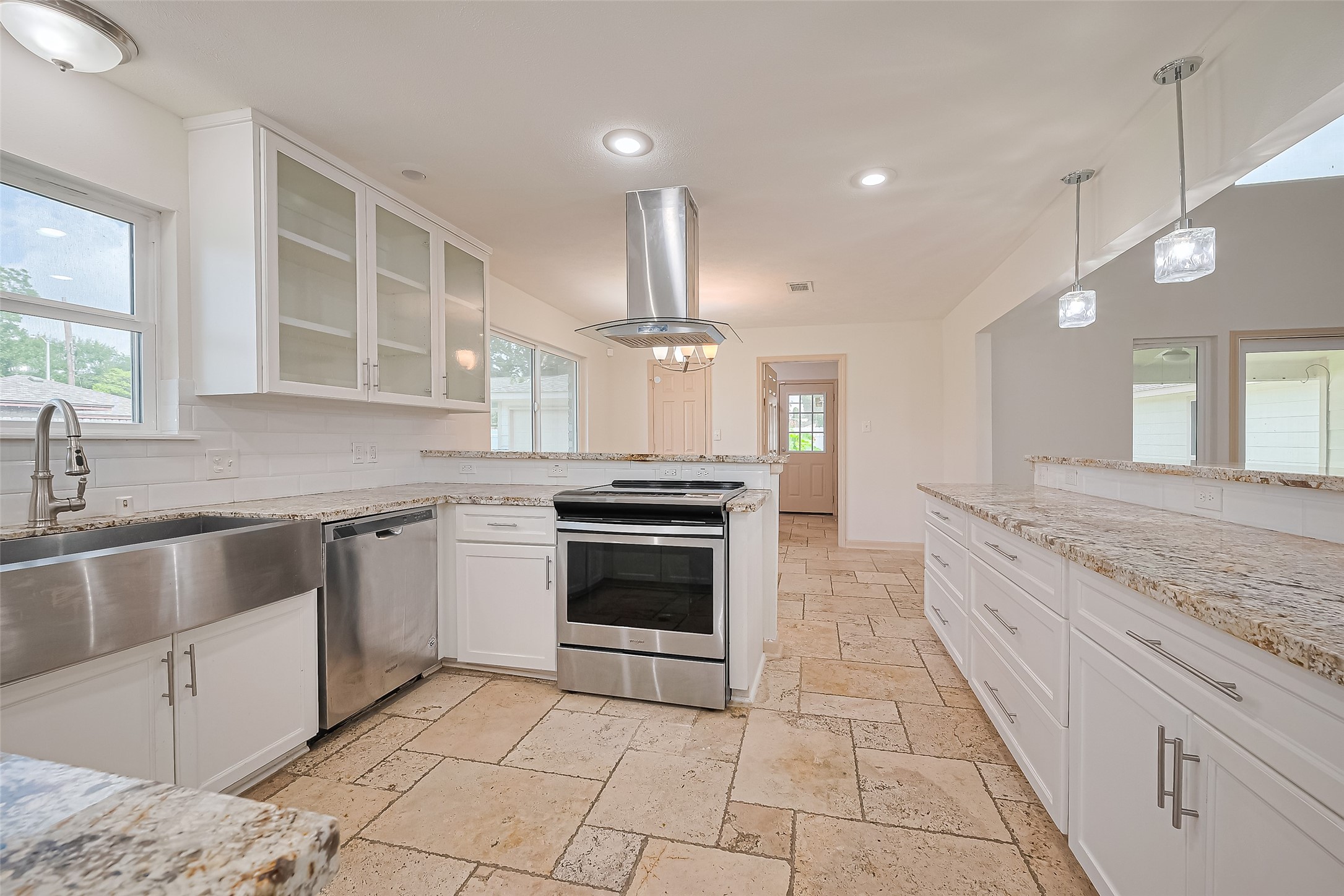982 West Donovan Street Houston, TX 77091 - Photo 8 of 39 a large kitchen with granite countertop a stove and a sink