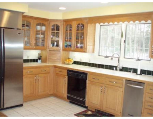 298 College Road Concord, MA 01742 - Photo 5 of 19 a kitchen with stainless steel appliances granite countertop a refrigerator and sink