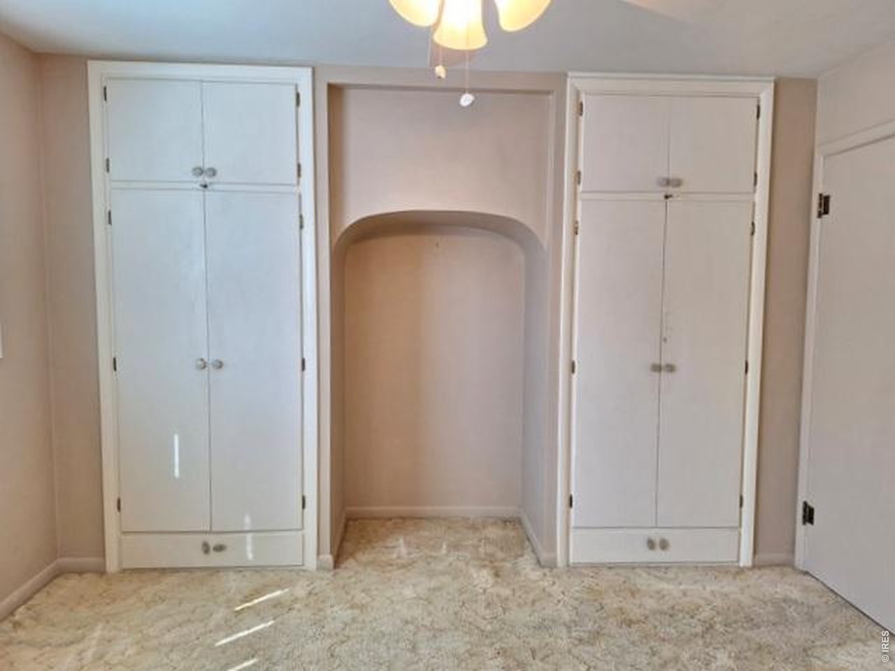 310 Cleveland Street Sterling, CO 80751 - Photo 13 of 25 Primary Bedroom 2 Closet Cabinets