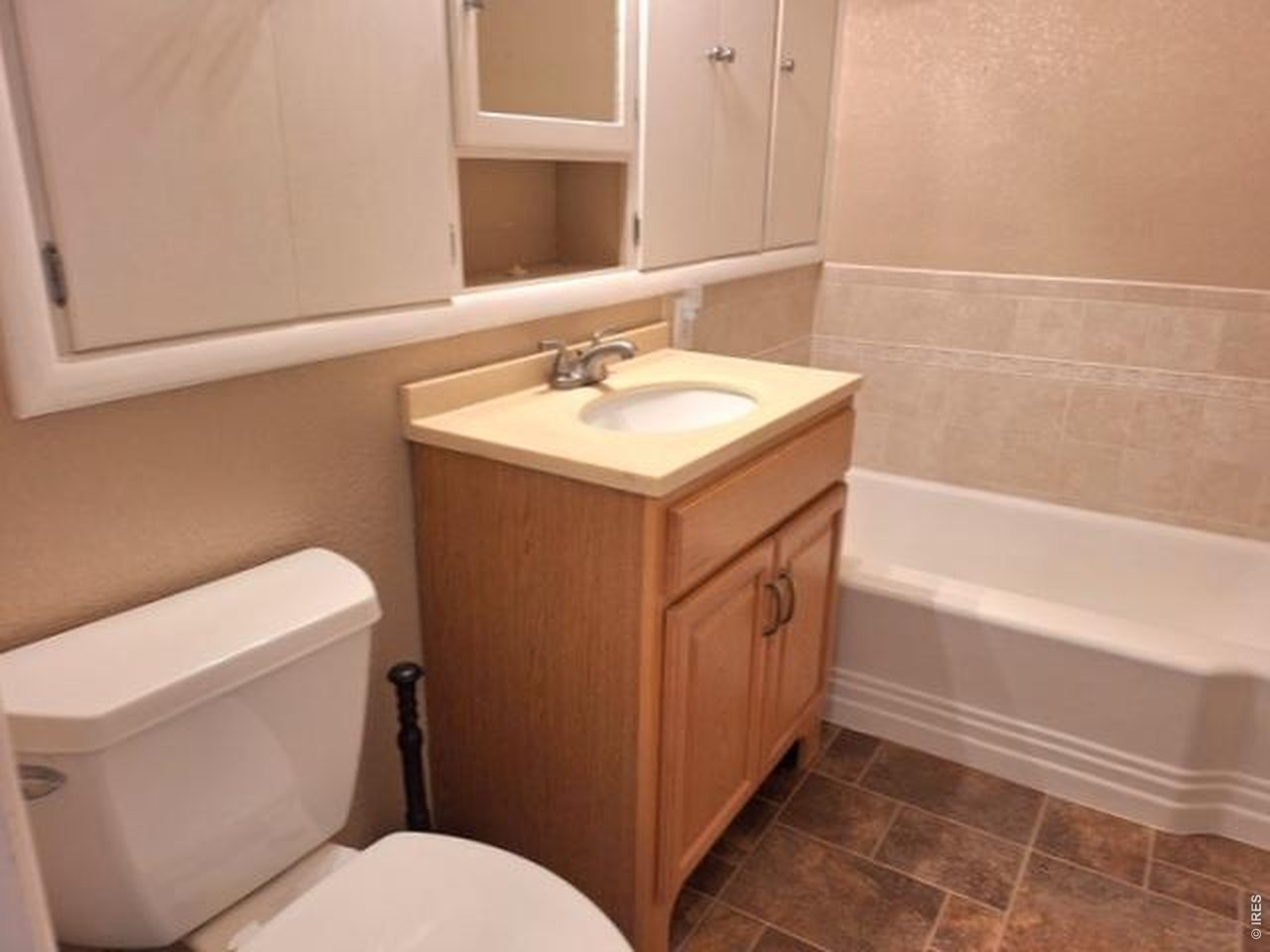 310 Cleveland Street Sterling, CO 80751 - Photo 18 of 25 Bathroom with Tub and Separate Shower