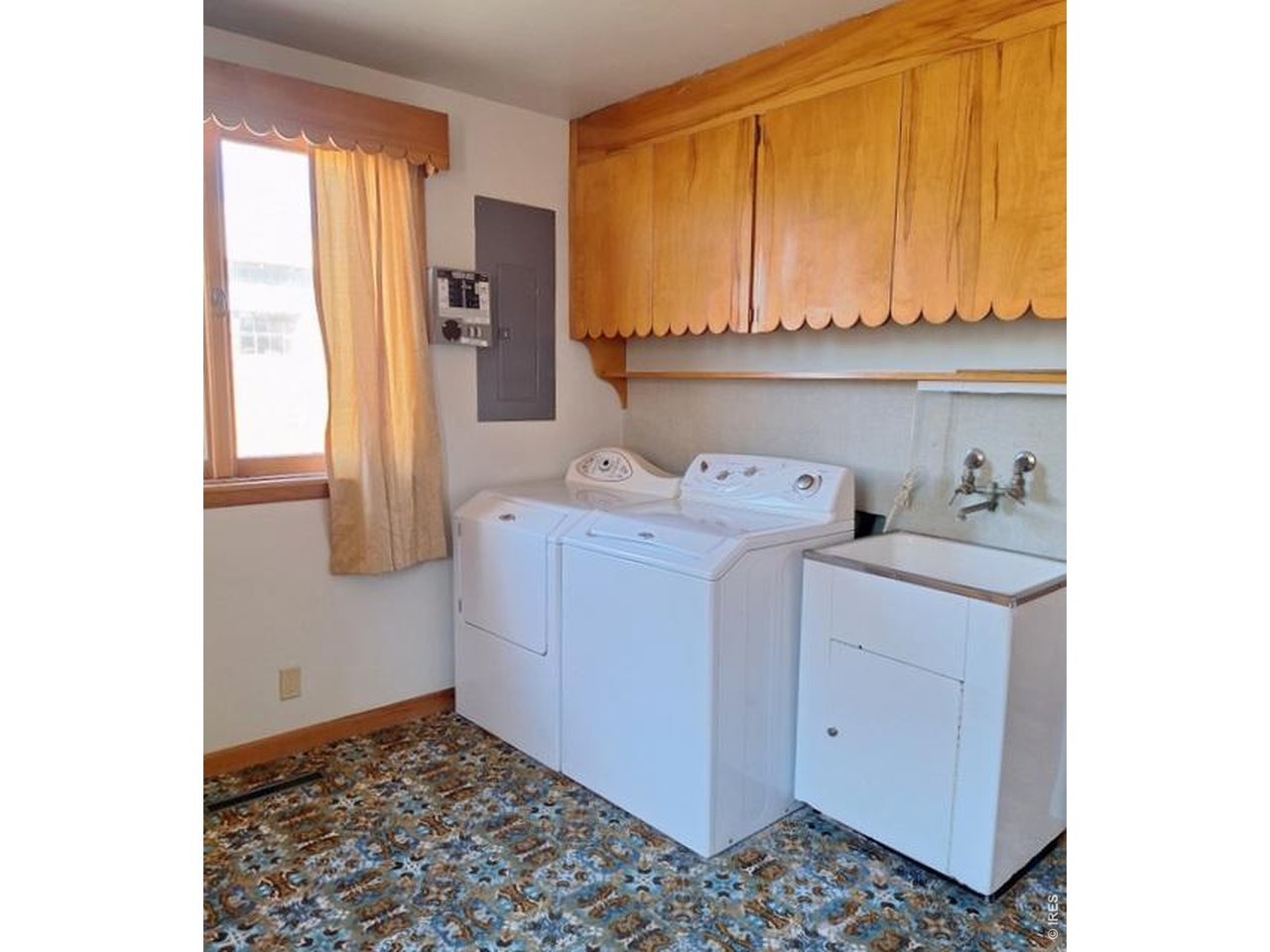 310 Cleveland Street Sterling, CO 80751 - Photo 20 of 25 Laundry Room with Utility Sink