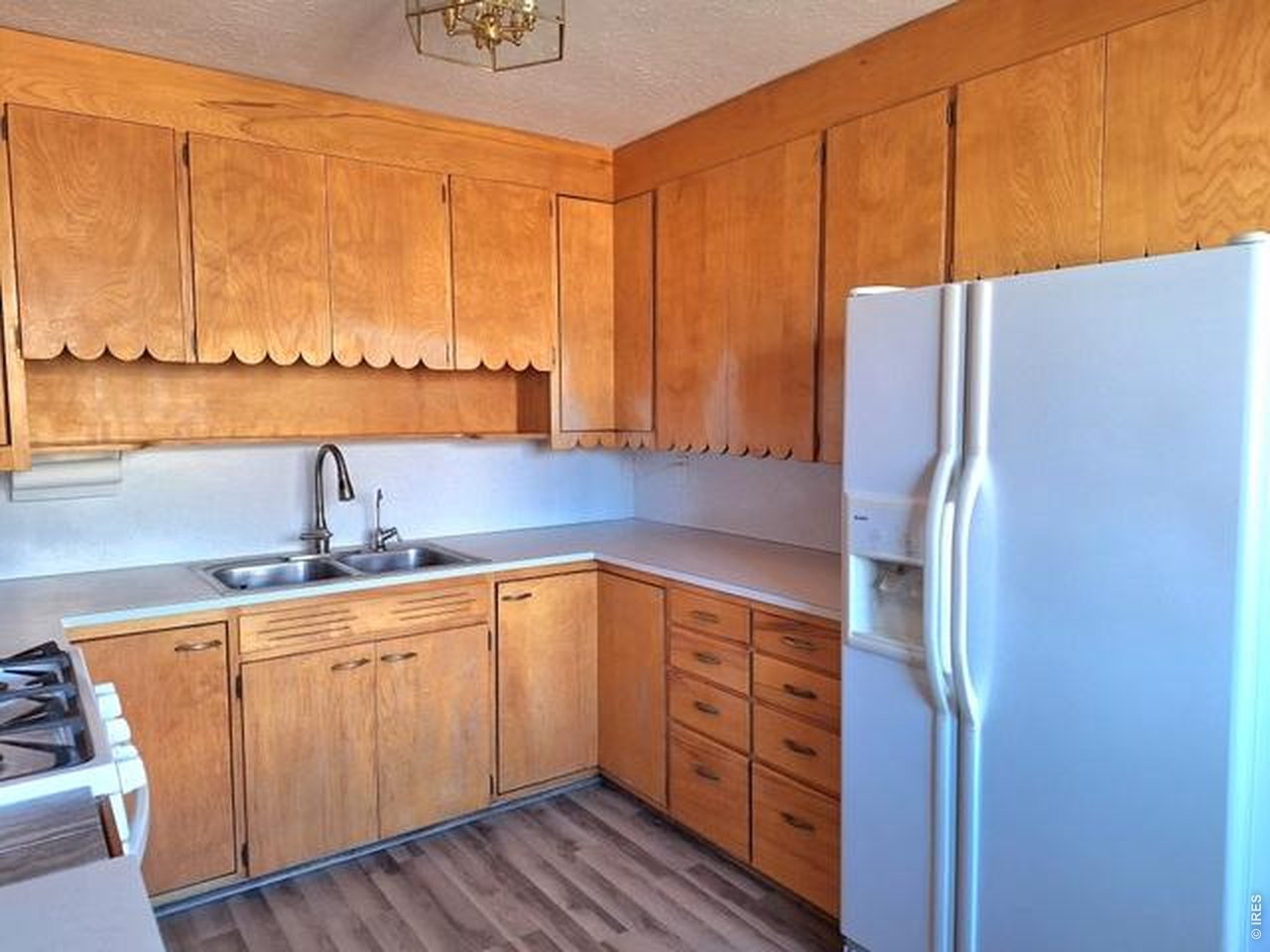 310 Cleveland Street Sterling, CO 80751 - Photo 7 of 25 Kitchen with Refrigerator