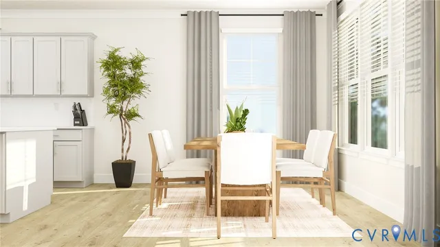 a view of a livingroom with furniture and a potted plant