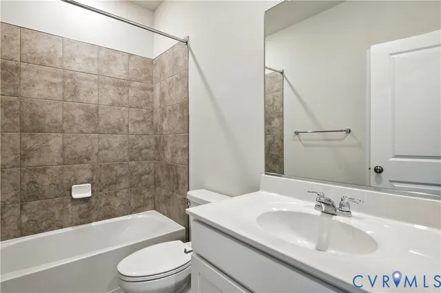 a bathroom with a sink a toilet and a bathtub