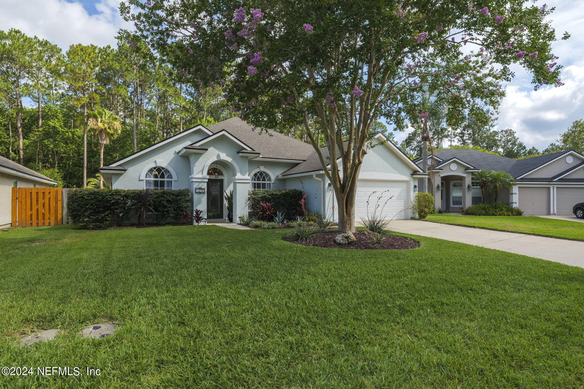 1273 Ribbon Road St. Johns, FL 32259 - Photo 7 of 50 a front view of a house with a garden and yard