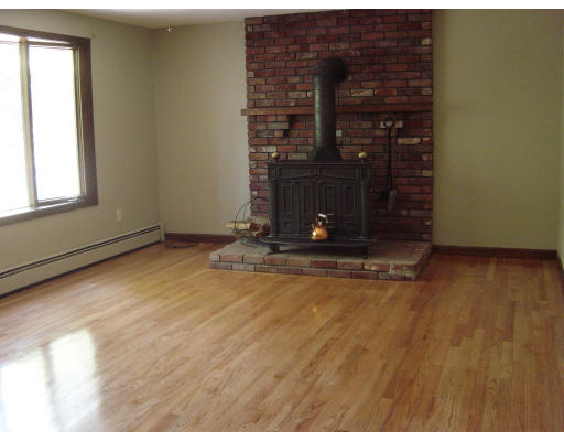4 Still River Road Sterling, MA 01564 - Photo 4 of 6 a view of empty room with fireplace