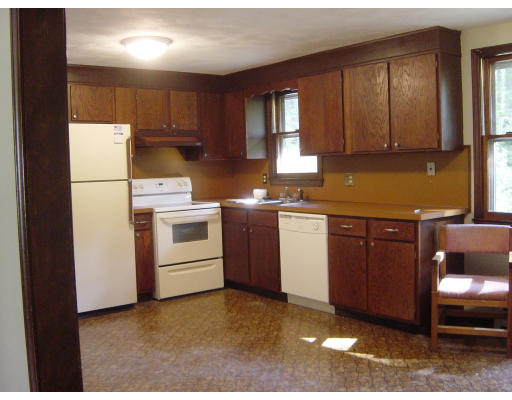 4 Still River Road Sterling, MA 01564 - Photo 5 of 6 a kitchen with a sink a stove and cabinets