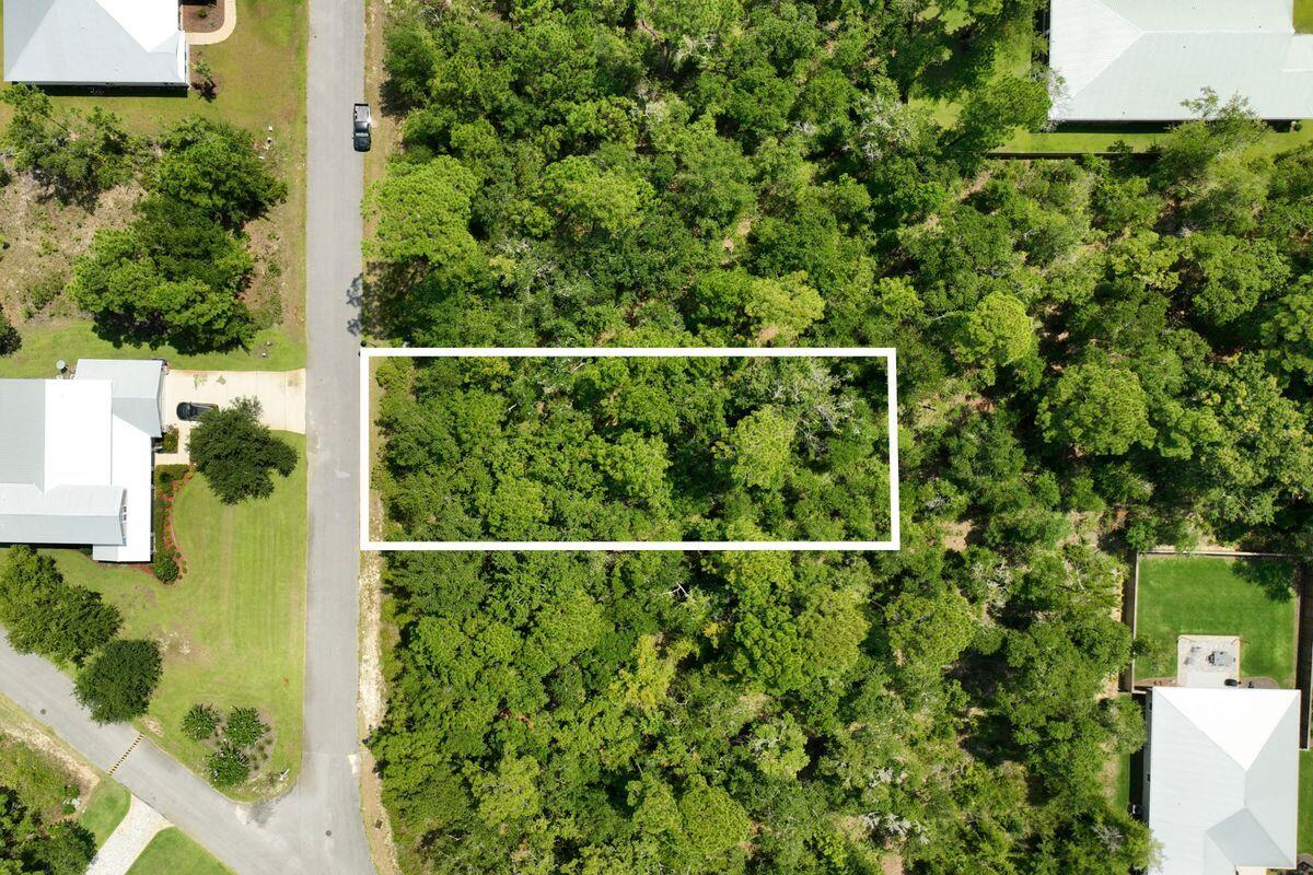 Lot 52 Muzzle Street Freeport, FL 32439 - Photo 5 of 13 a view of a fence in a garden