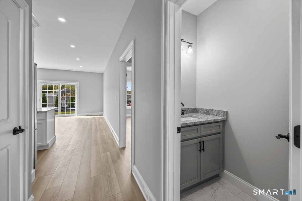 210 Munson Road, Unit 1B Wolcott, CT 06716 - Photo 22 of 28 Hallway view of half bath