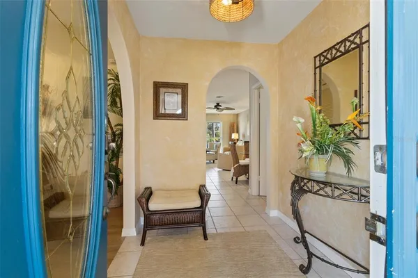 a view of a dining room with furniture and chandelier
