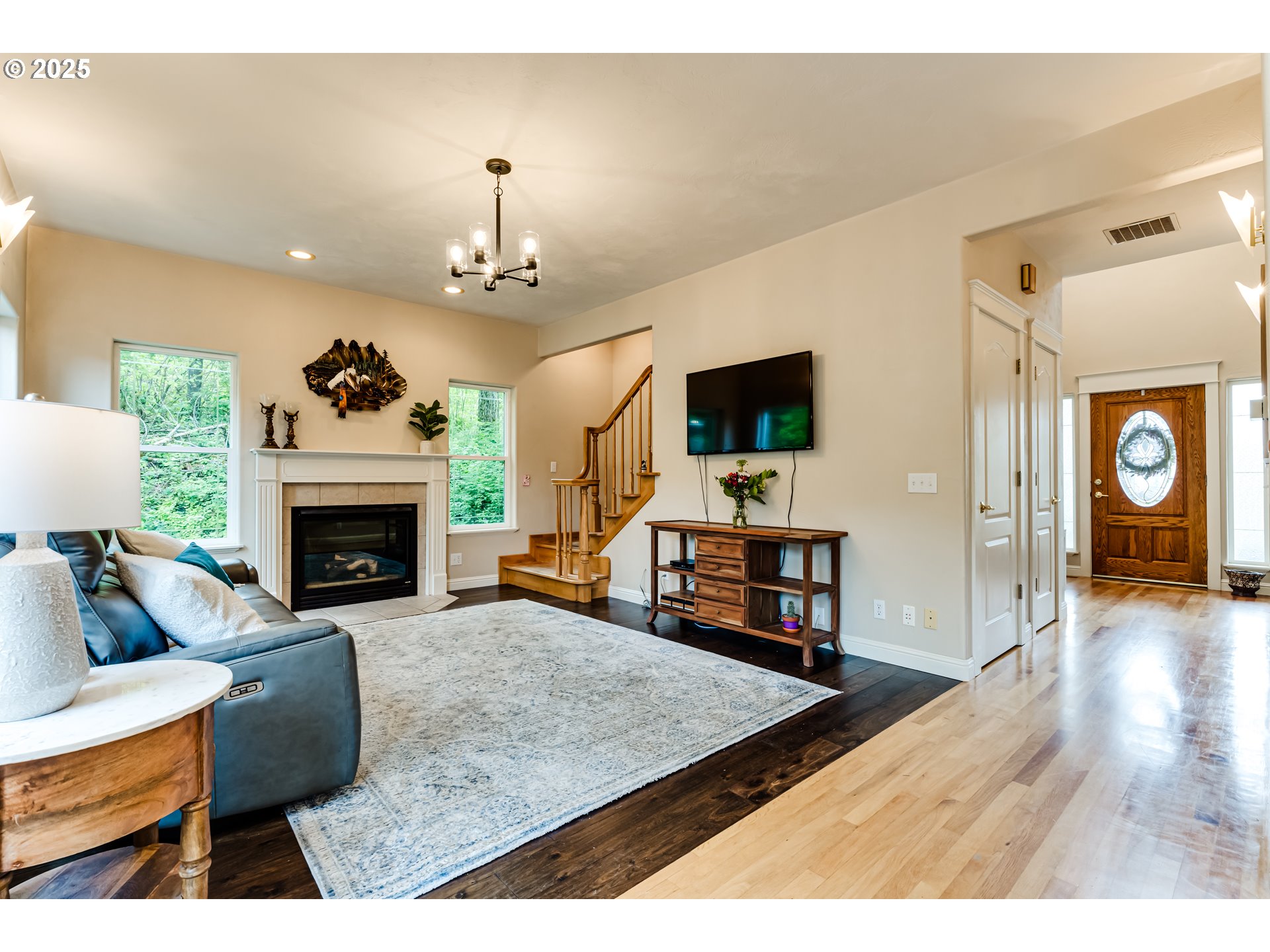 1187 South 69th Street Springfield, OR 97478 - Photo 11 of 42 a living room with furniture flat screen tv and a fireplace