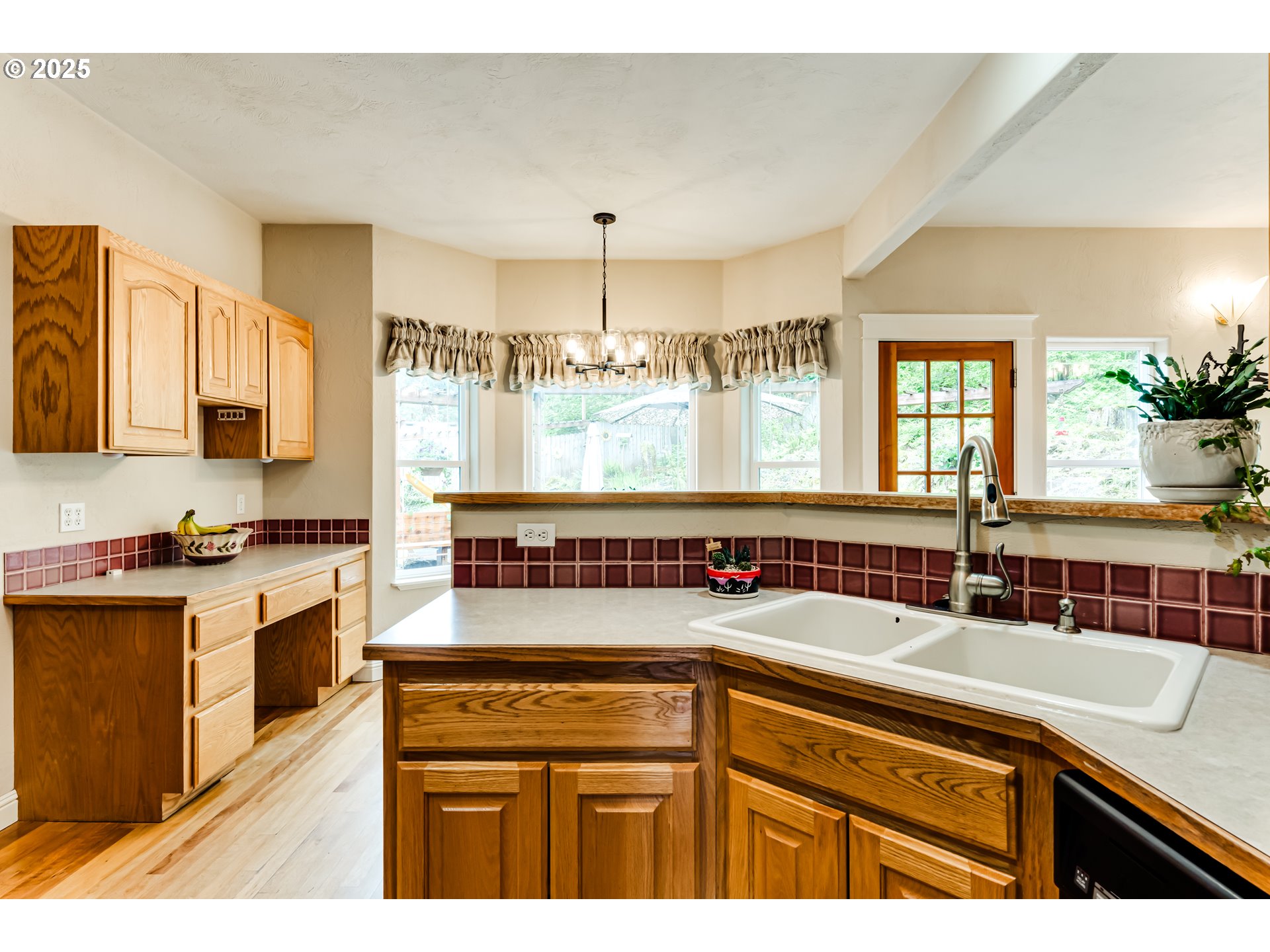 1187 South 69th Street Springfield, OR 97478 - Photo 14 of 42 a kitchen with a sink stove and cabinets