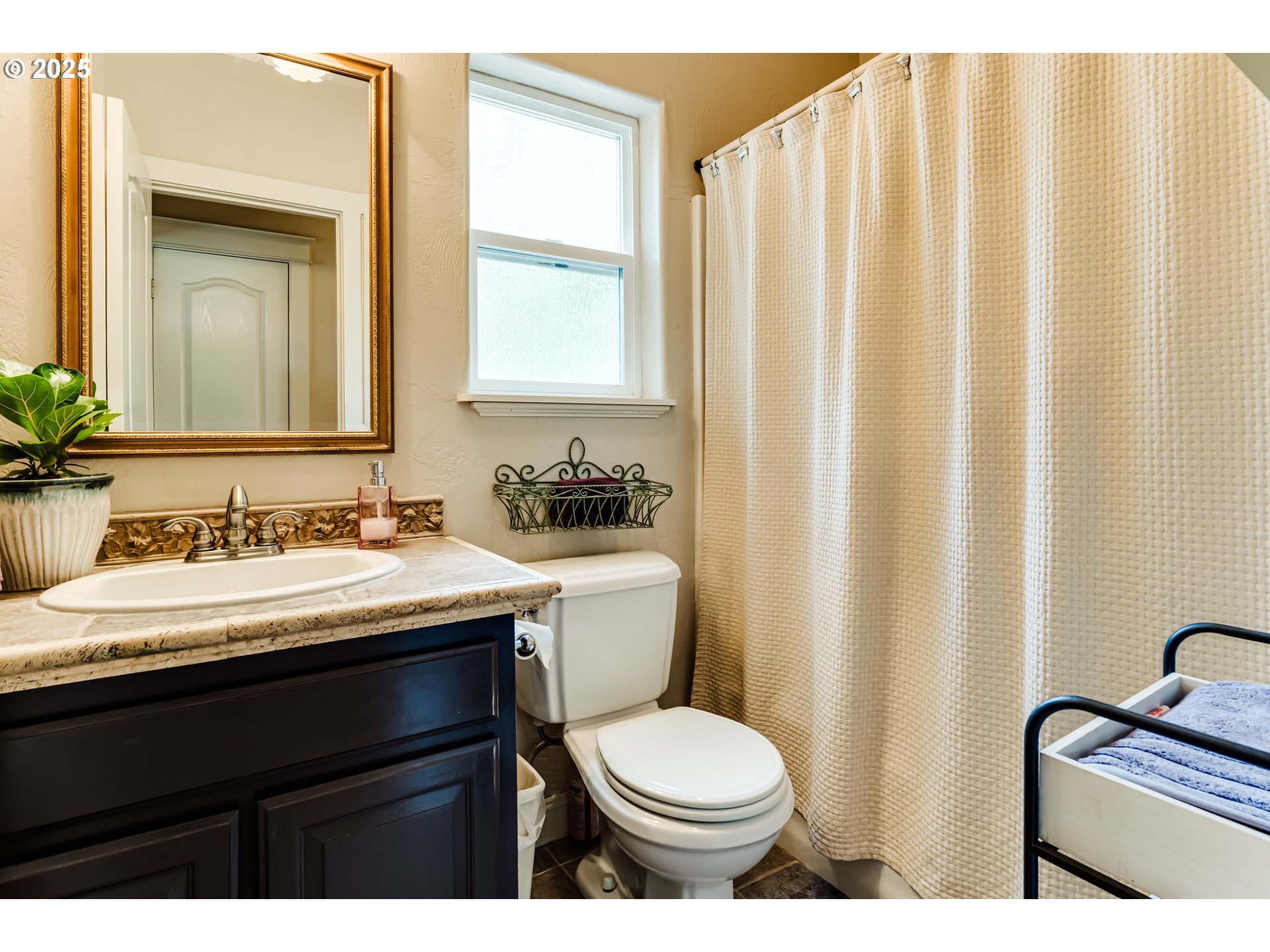 1187 South 69th Street Springfield, OR 97478 - Photo 20 of 42 a bathroom with a granite countertop sink toilet and mirror
