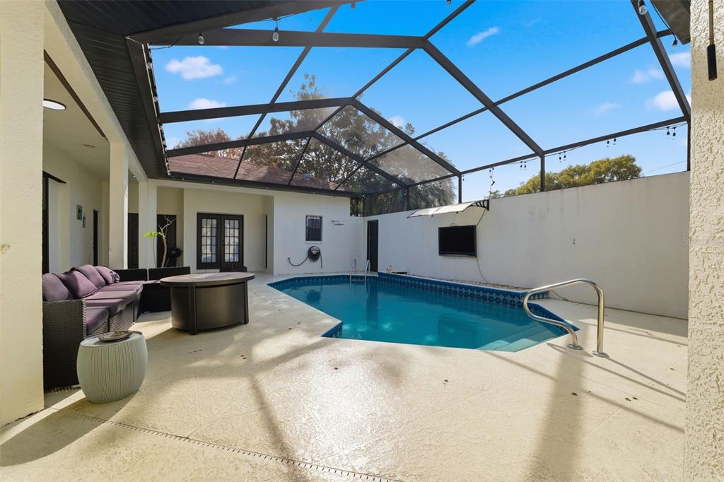 8451 Delta Court Weeki Wachee, FL 34613 - Photo 11 of 64 a view of a patio with a table and chairs