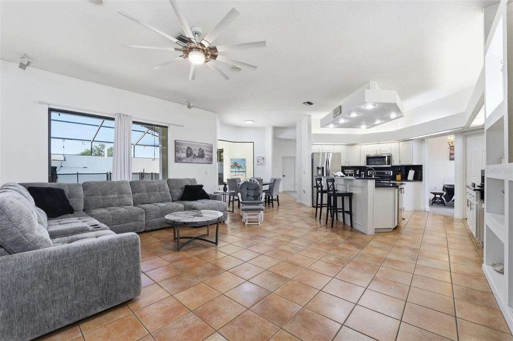 8451 Delta Court Weeki Wachee, FL 34613 - Photo 23 of 64 a living room with furniture and kitchen view