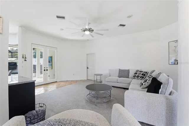 a view of a livingroom with wooden floor and a flat screen tv