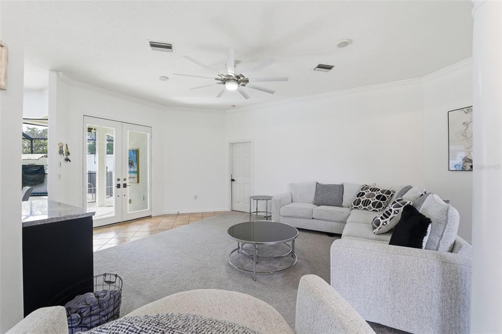 8451 Delta Court Weeki Wachee, FL 34613 - Photo 28 of 64 a living room with furniture and view of kitchen