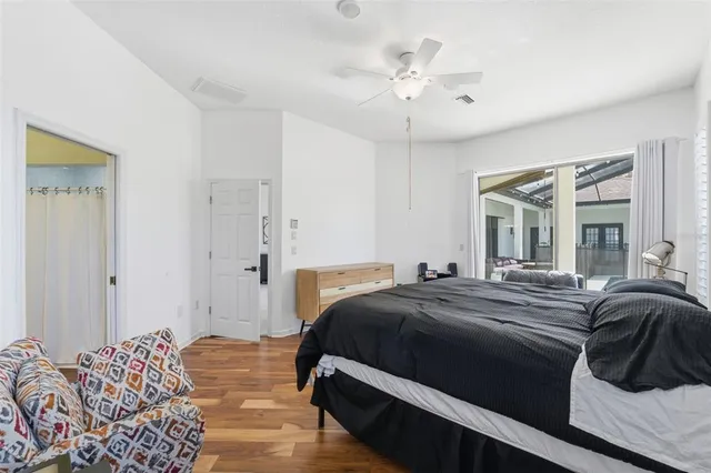 a bedroom with a bed and a dresser in it