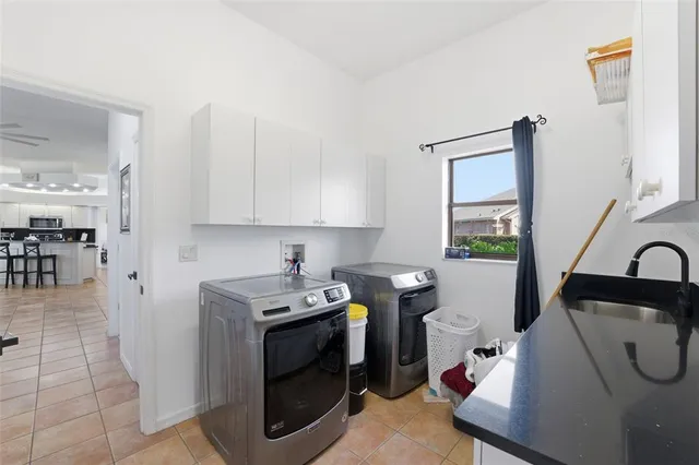 an aerial view of a house with a yard and garden