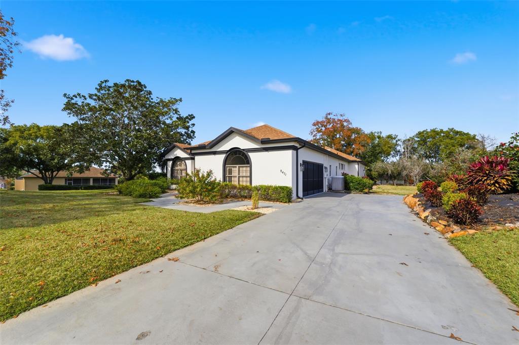 8451 Delta Court Weeki Wachee, FL 34613 - Photo 52 of 64 a front view of a house with a yard
