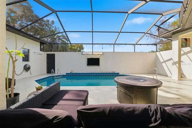 a kitchen with stainless steel appliances granite countertop a refrigerator a stove and a sink