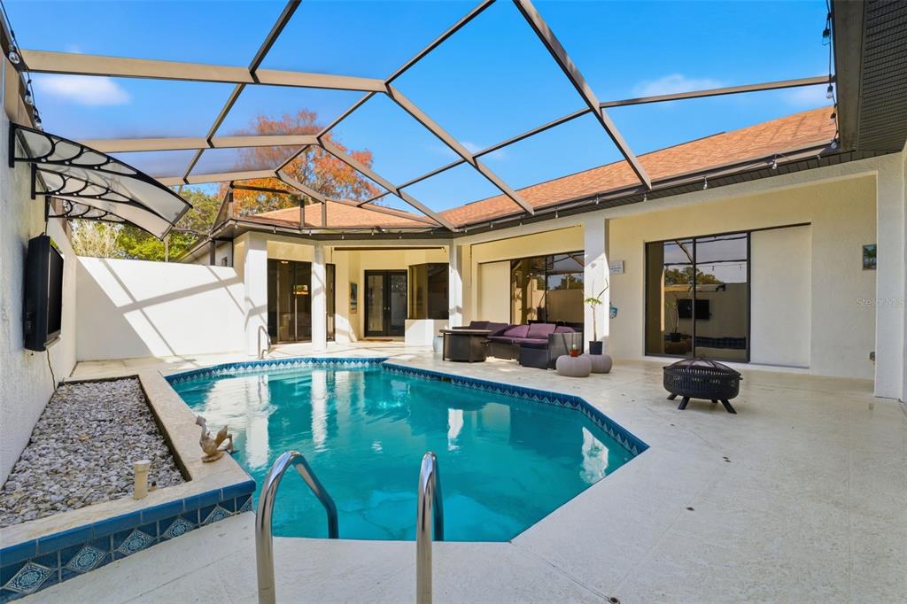 8451 Delta Court Weeki Wachee, FL 34613 - Photo 8 of 64 a view of a swimming pool with seating area