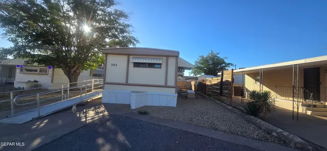 a house view with a backyard space