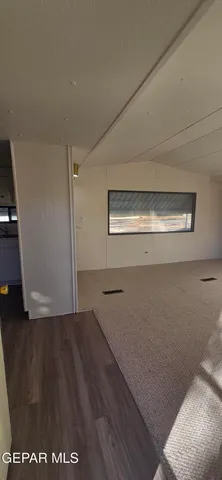 an empty room with wooden floor