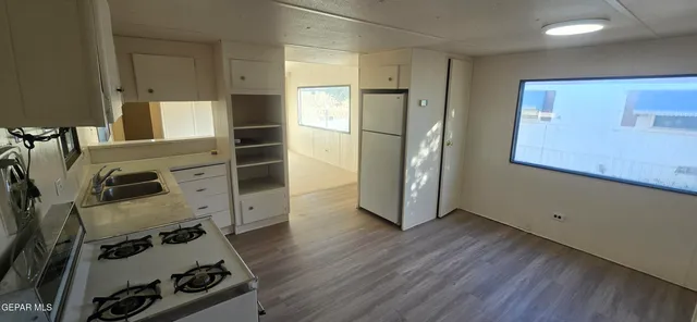 a view of a storage & utility room with two washing machine