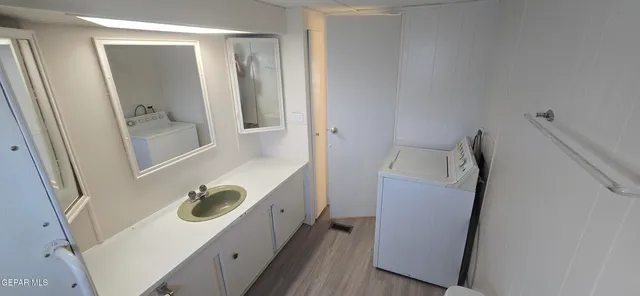 a bathroom with a sink and mirror