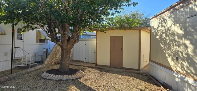 a view of a backyard of the house