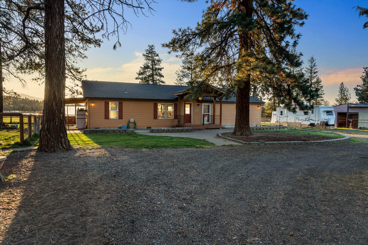 67500 Harrington Loop Road Bend, OR 97703 - Photo 7 of 72 a view of a house with a yard