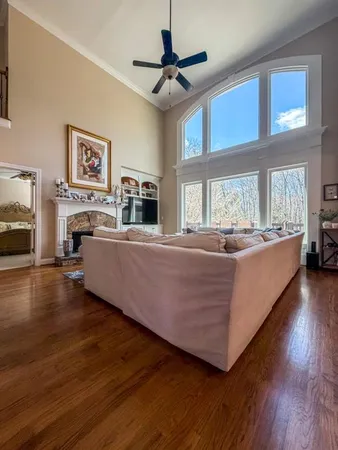 a living room with furniture and fireplace