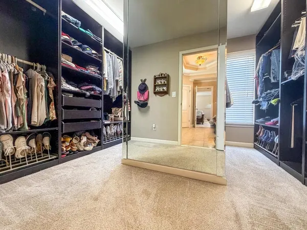 a view of an empty room with furniture