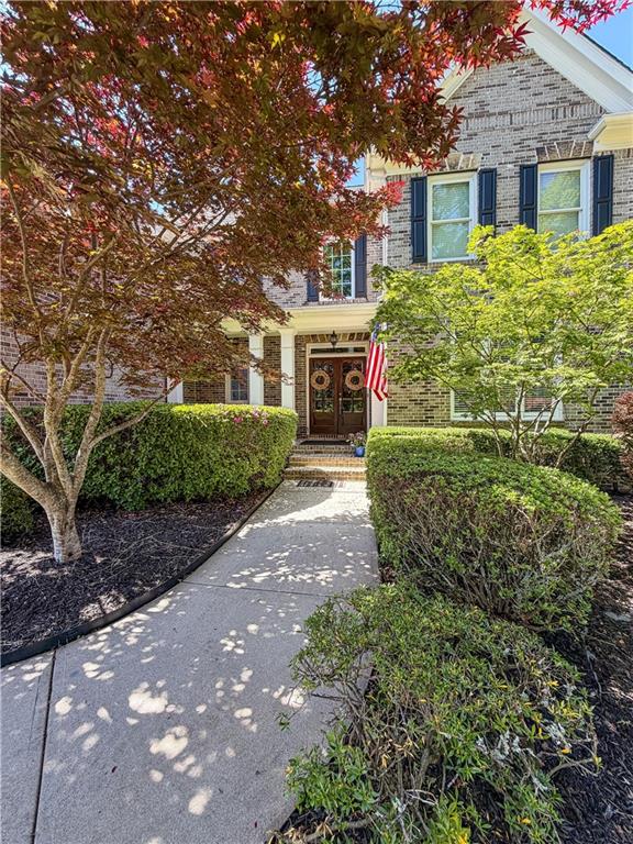 310 Flatstone Way Marietta, GA 30064 - Photo 15 of 44 a front view of a house with yard and parking